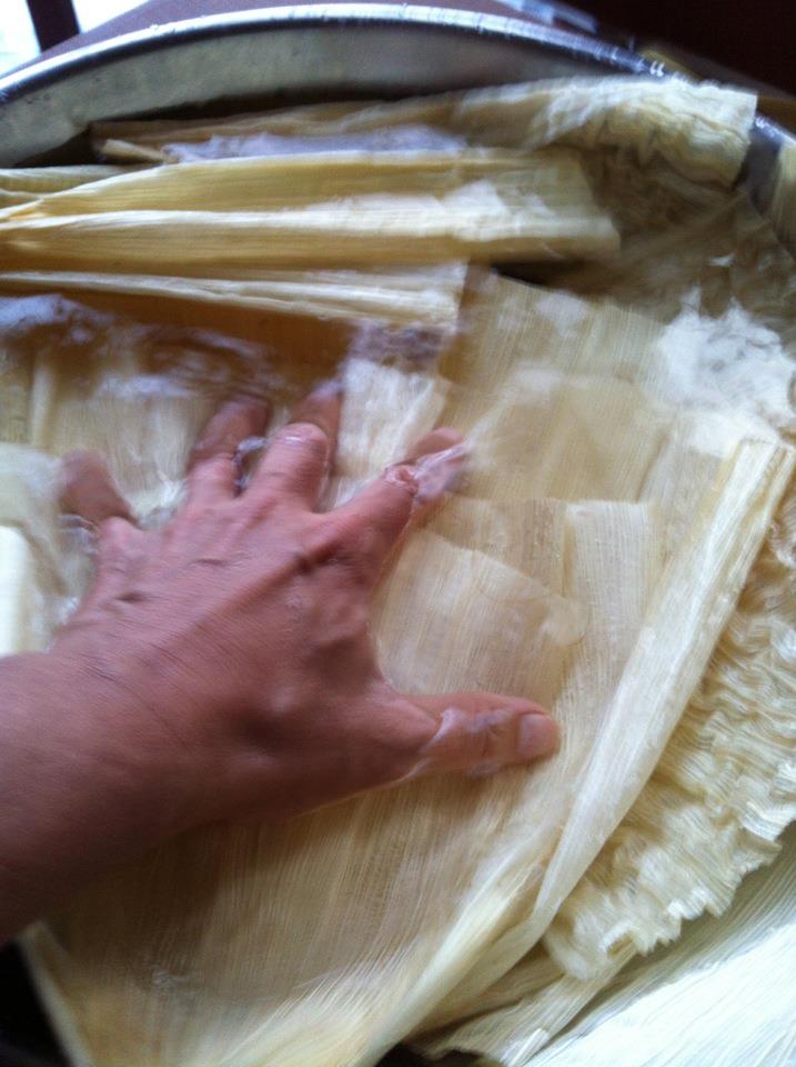 For bean tamales, first, soak the corn husks to soften them