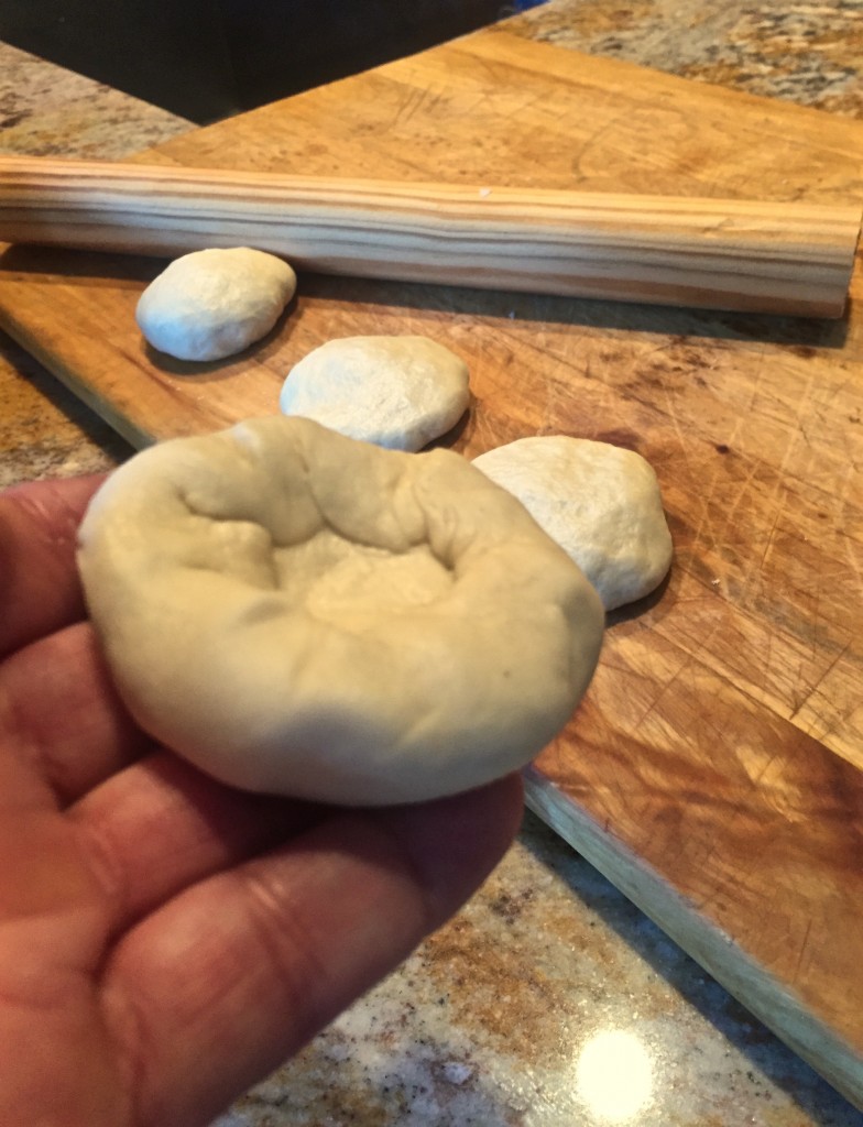 Buñuelos start with a tortilla. To roll out the perfect tortilla, start by forming a testal, little pillow. 
