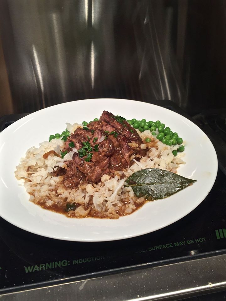 Riced caulifower forms a bed for carne guisada, braised beef