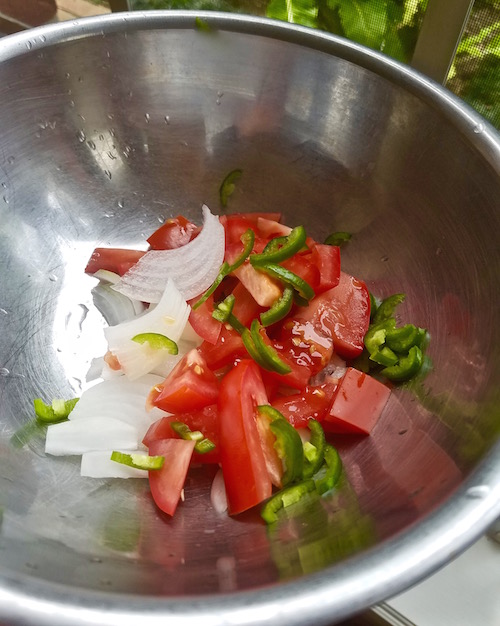 Verdolaga, purslane is cooked with three classic ingredients, tomato, onion and chile