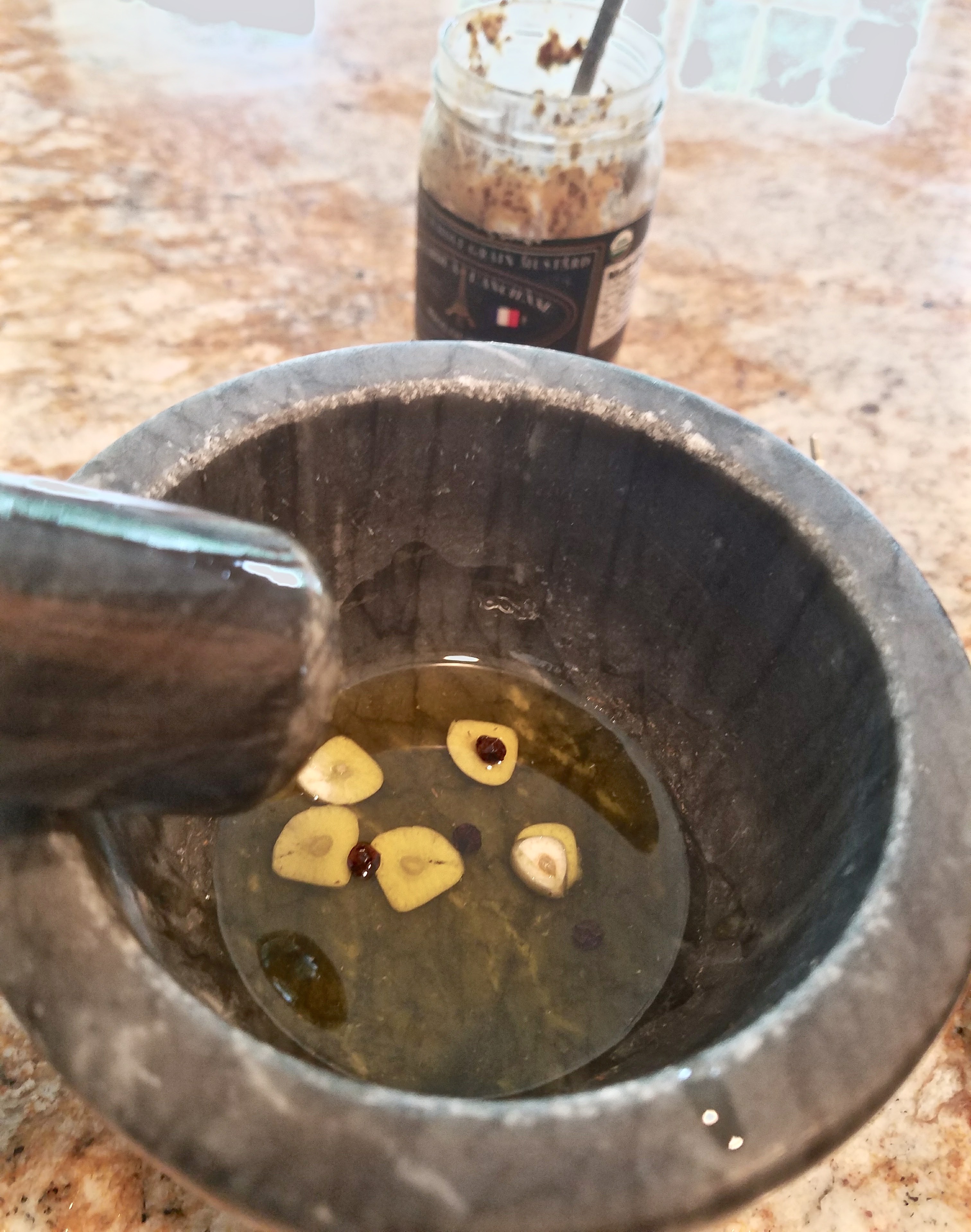 French vinaigrette salad dressing starts in a mortar and pestle