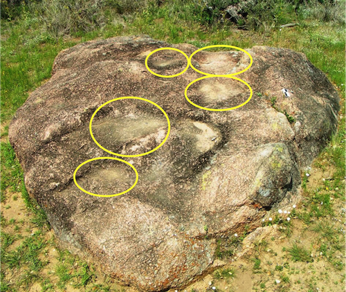 Five individual mortars in this bedrock granite mortar bench. Mortars can be used to make vinaigrette salad dressing.