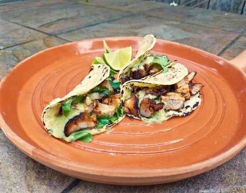 Tacos Al Pastor with rich, rustic avocado and roasted serrano salsa